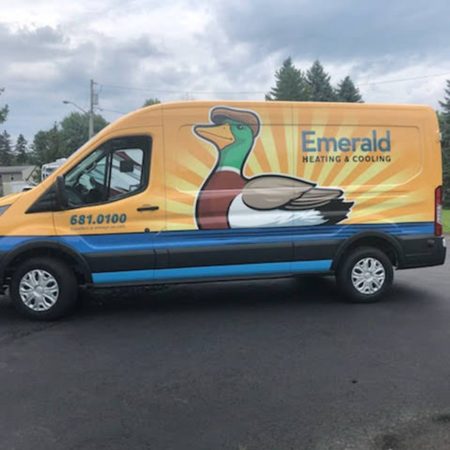Side view of a Emerald Heating & Cooling truck