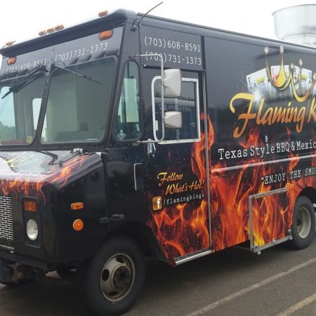 Flaming Kings food truck parked in an industrial parking lot